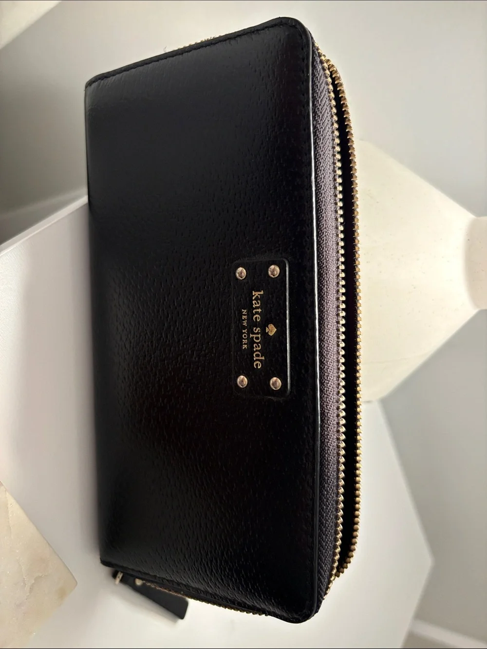 kate spade Black Pebbled Zip-Around Wallet with Gold Plaque